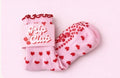 Pink Pilates grip socks with red hearts