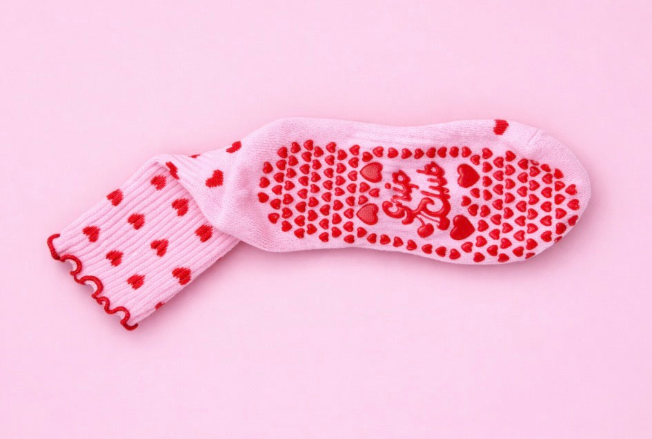 Pink Pilates grip socks with red hearts