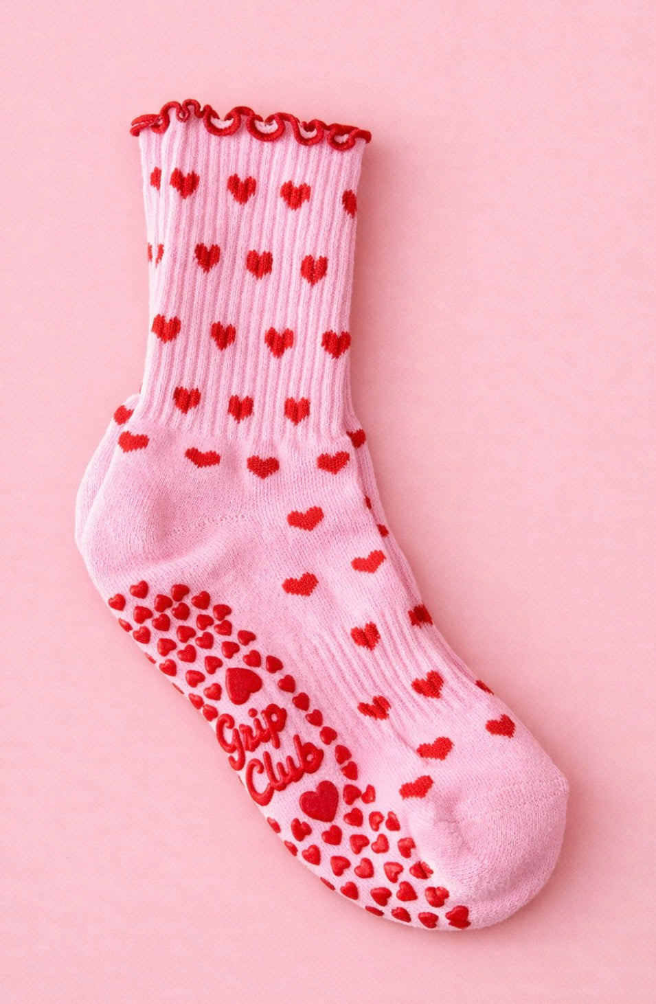 Pink Pilates grip socks with red hearts